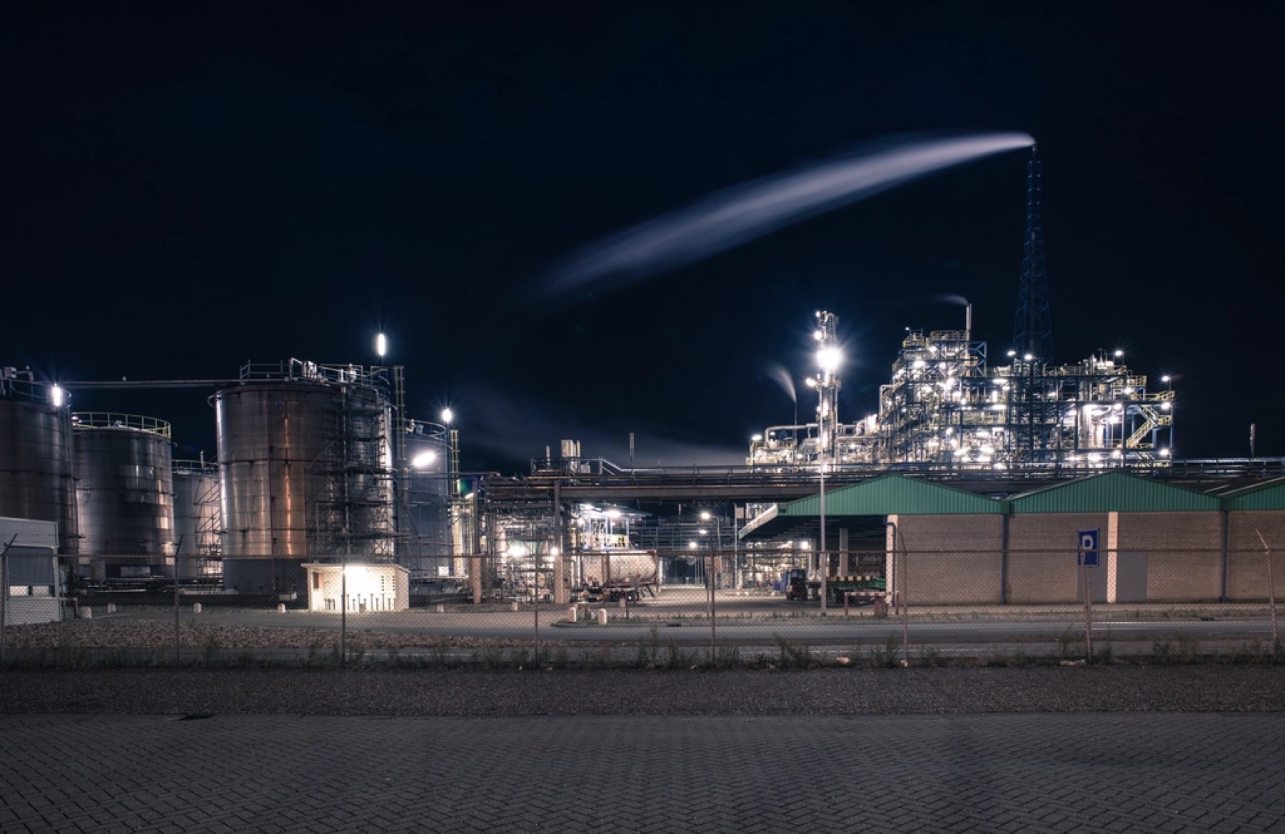 An industrial plant lit up at night